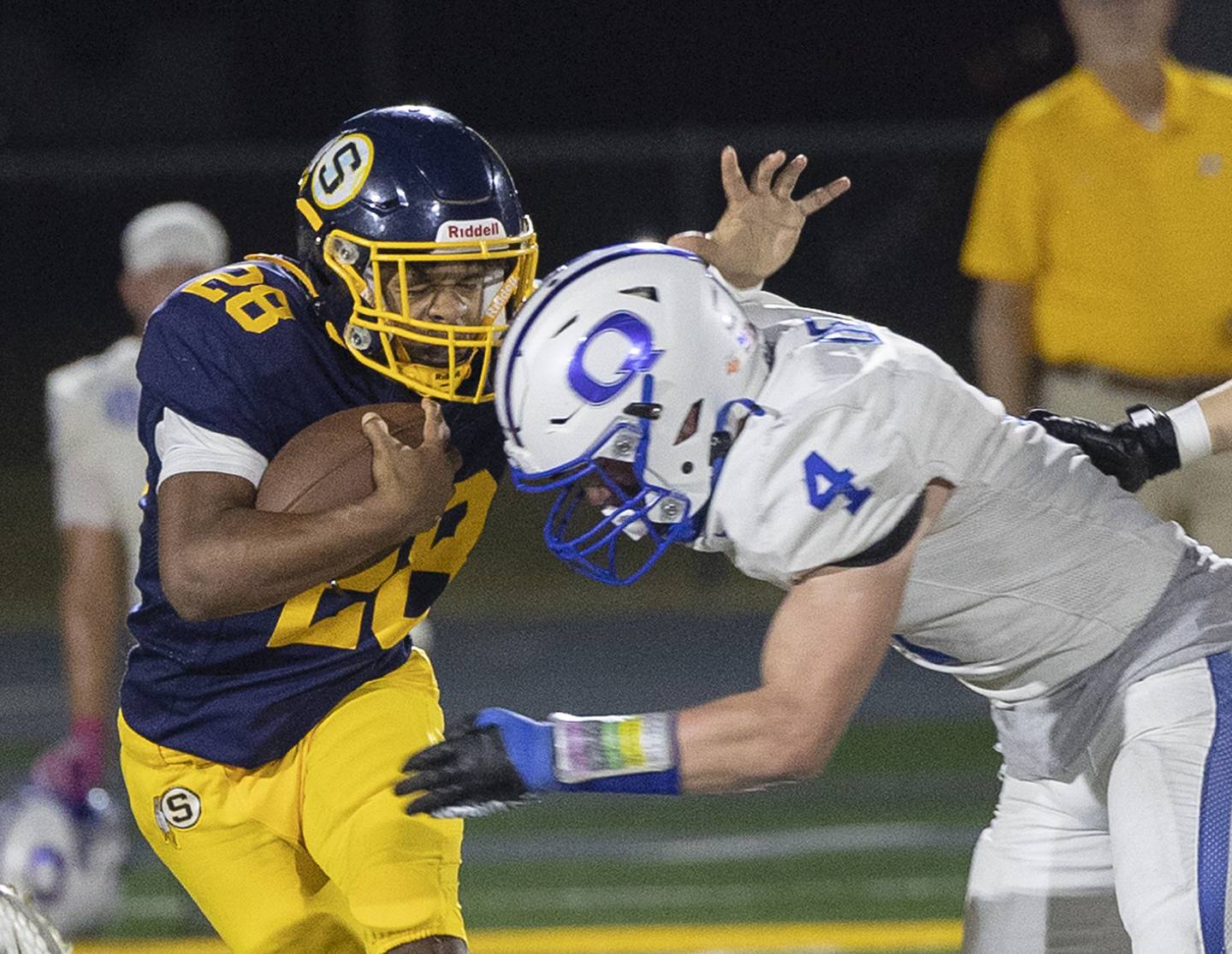 Sterling’s Marice De La Cruz is hit by Quincy’s Mason Dent Friday, Oct. 17, 2025.