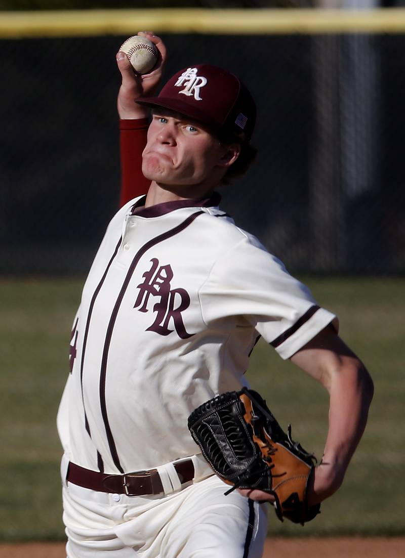 Prairie Ridge’s Trace Vrbancic throws a pitch during a Fox Valley Conference baseball game against Huntley Wednesday, April 12, 2023, at Prairie Ridge High School.
