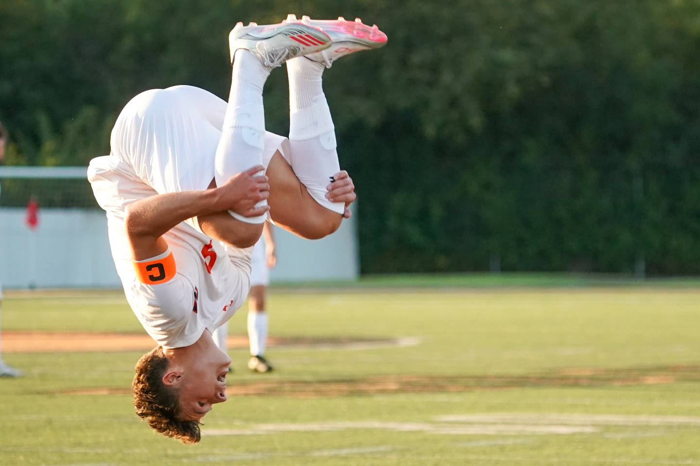 Oswego’s Dustin King (9) does a back flip in celebration of a goal he scored against Wheaton Warrenville South during a soccer match at Wheaton Warrenville South in Wheaton on Thursday, Aug 28, 2025.