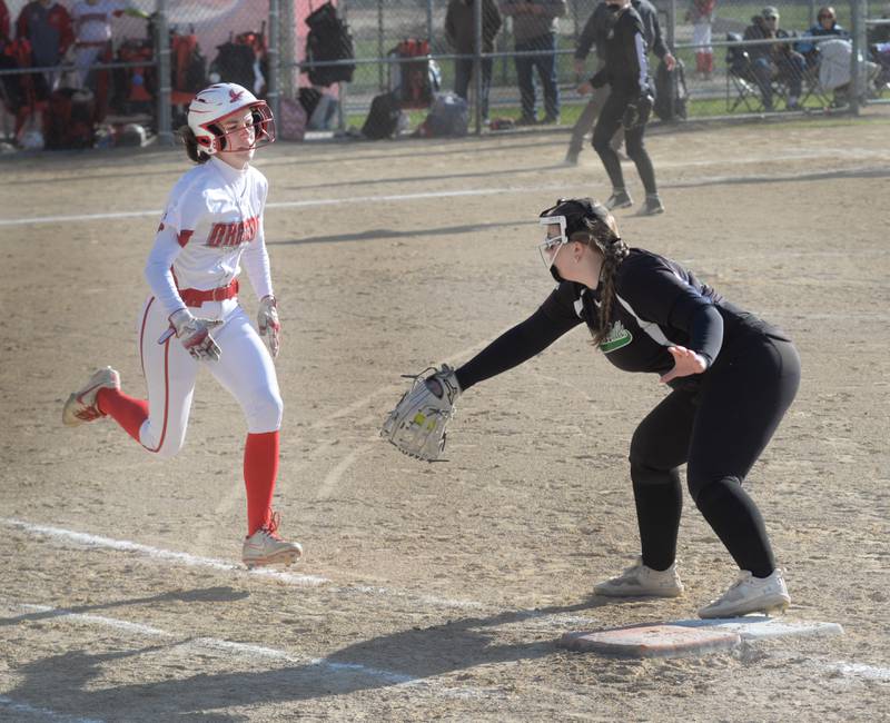 Rock Falls' Abi Skibinskie reaches for the ball for an out as Oregon's Abree Barker tries to beat it out during a Monday, April 14, 2025 game at Oregon Park West.