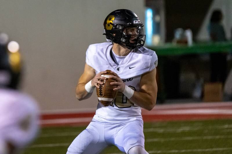 Burke Gautcher of Sycamore looks for receiver on Friday, October 11, 2024 at Howard Fellows Stadium in LaSalle.