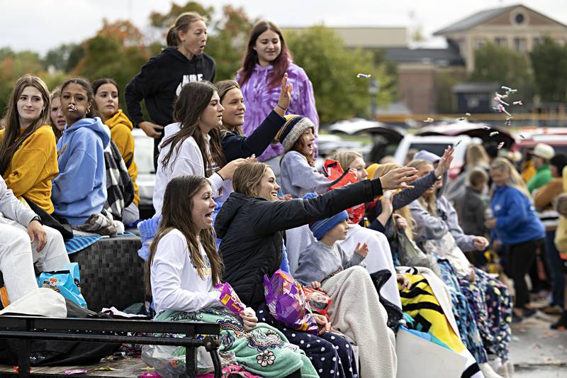 The Sterling volleyball team fires off candy from their float Friday, Oct.6, 2023 during the parade.