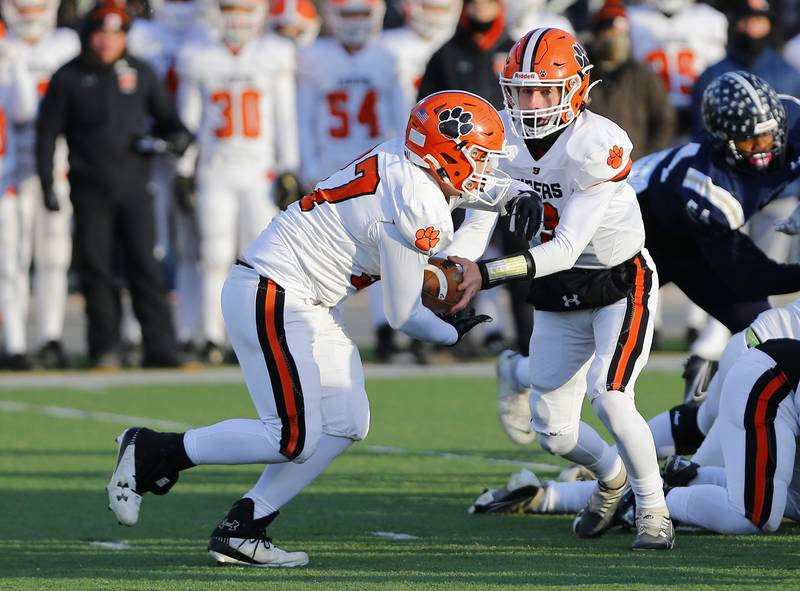 Byron's Caden Considine (37) takes a handoff during a Class 3A varsity football semi-final playoff game between Byron High School and IC Catholic Prep on Saturday, Nov. 19, 2022 in Elmhurst, IL.