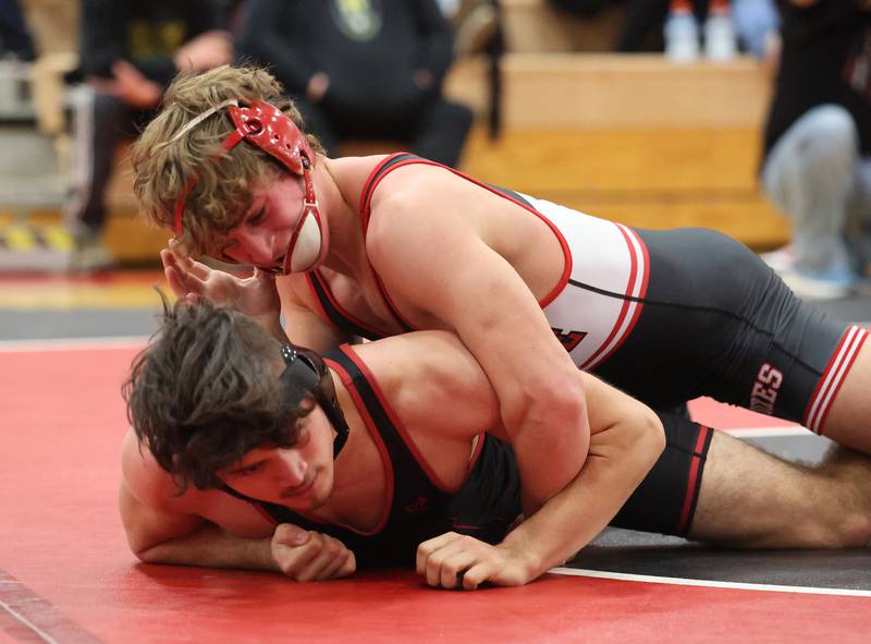 Yorkville's Luke Zook goes up against against Plainfield North's Julian De La Rossa during the Southwest Prairie Conference wrestling meet at Yorkville High School on Saturday, Jan. 21, 2023.