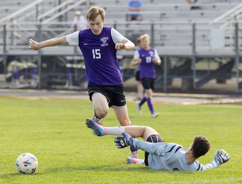 Dixon’s Logan Grett leaps over Rockford Lutheran goalie Tre Wasemiller Wednesday, Sept. 18, 2024.