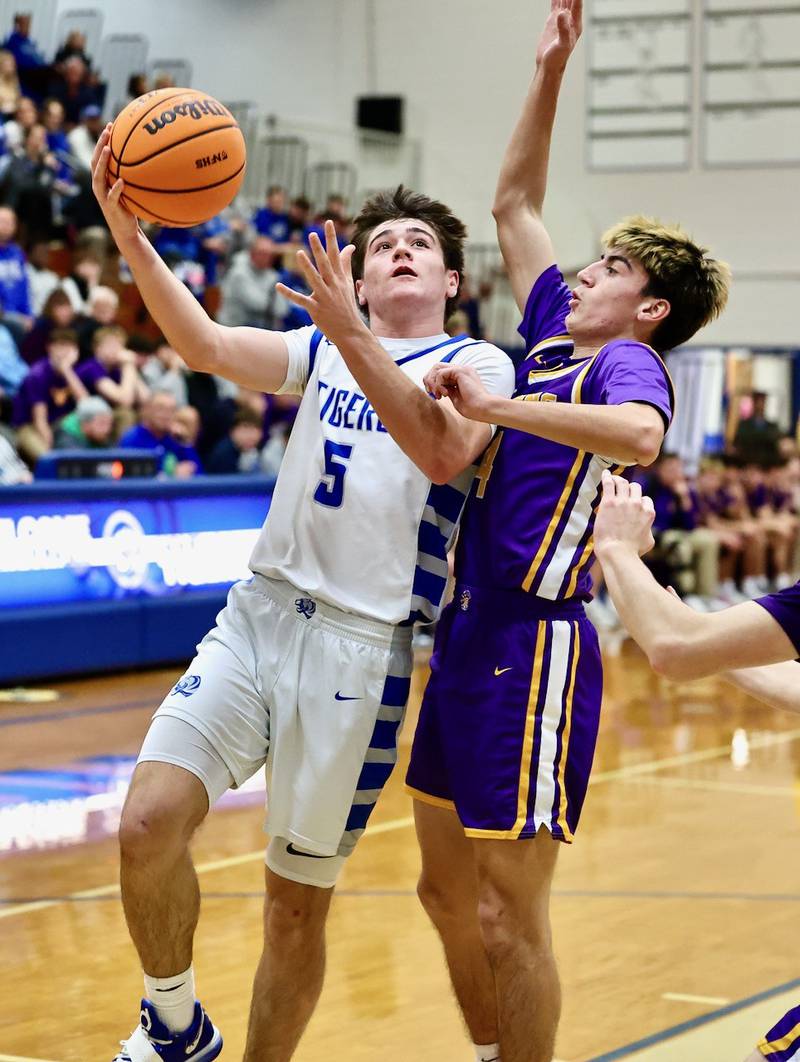 Princeton's Jack Oester shoots over Mendota's Johan Cortez Friday night at Prouty Gym.