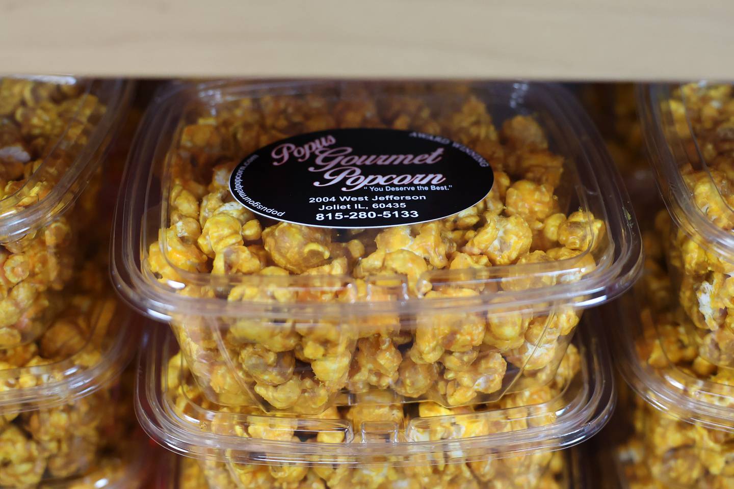 Gourmet popcorn sits on the shelves at Popus Gourmet Popcorn in Joliet.