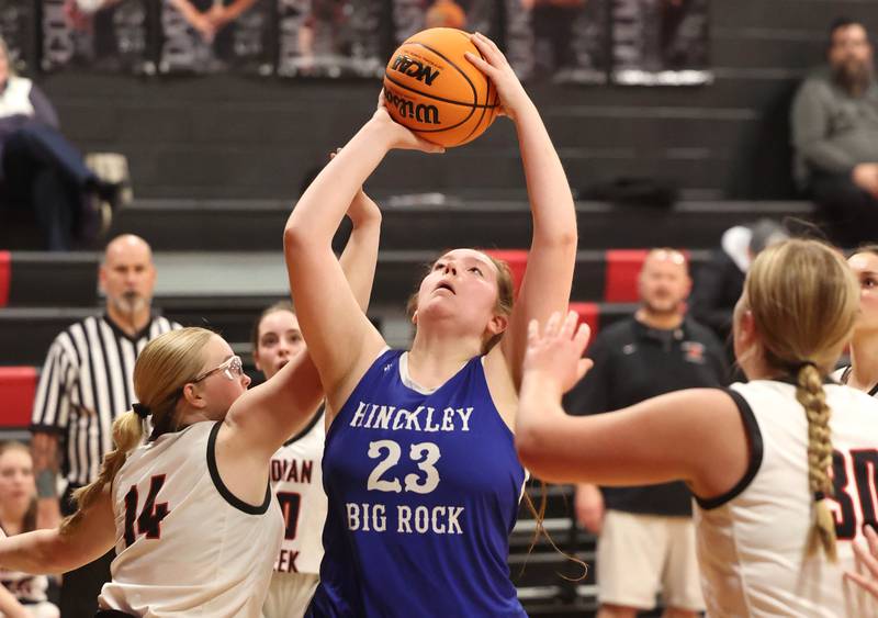 Hinckley-Big Rock's Sami Carlino shoots the ball in between a group of Indian Creek defenders during their game Monday, Jan. 13, 2025, at Indian Creek High School in Shabbona.