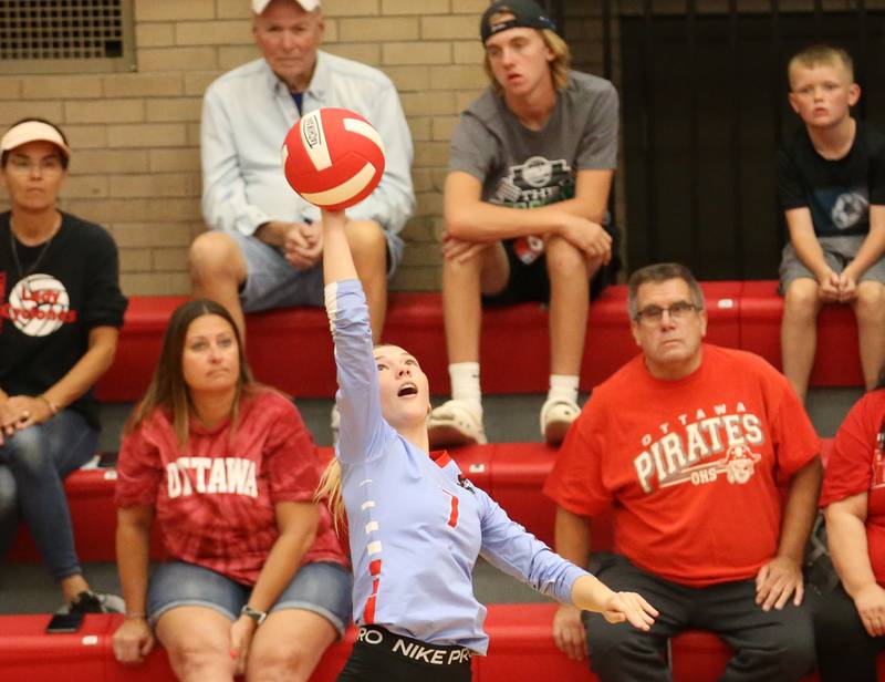 Ottawa's Ryleigh Stevenson leaps in the air to spike the ball to the Plano side of the net on Thursday, Aug. 31, 2023 in Kingman Gym at Ottawa High School.