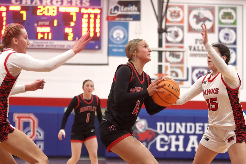 Huntley’s Anna Campanelli works under the hoop against Maine South in Komaromy Holiday Classic varsity girls basketball championship game action on Monday, Dec. 30, 2024, at Dundee-Crown High School in Carpentersville.