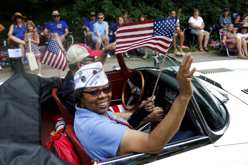 Veteran W. Joye Williams waves on Sunday, July 7, 2024, during Crystal Lake’s annual Independence Day Parade on Dole Avenue in Crystal Lake. This year’s parade feature close to 100 units.