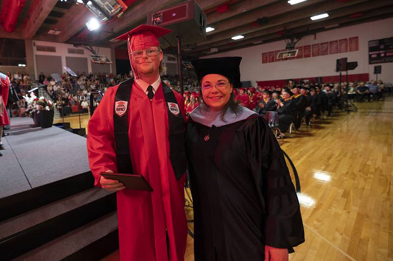 Sauk Valley Community College graduate Lucas Outzen poses for a photo with Dr. Lori Cortez Friday, May 15, 2026. Outzen is the first student who took part in SVCC’s Impact program to graduate. The program pays the school tuition in exchange for volunteer hours worked in the community.