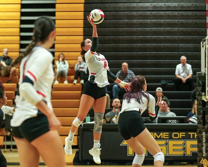 Bolingbrook's Sophia Barrera (5) tips the ball during regional final volleyball match between Bolingbrook at Joliet West.  Oct 26, 2023.