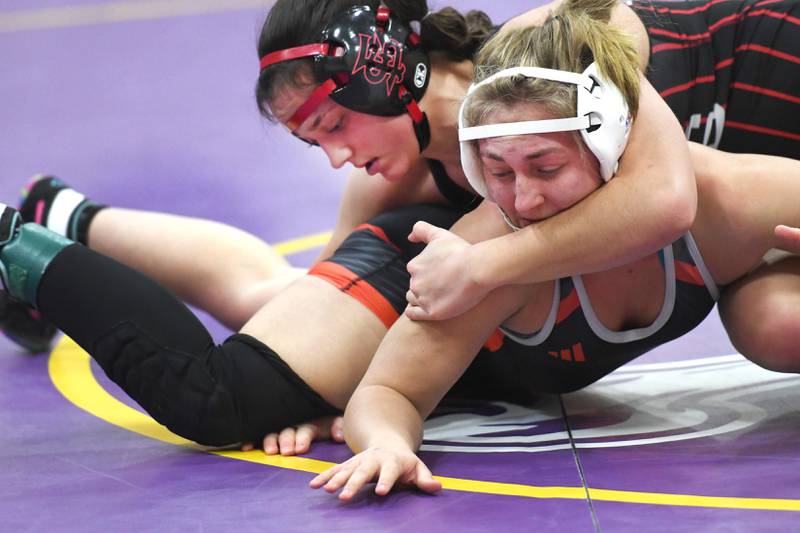 Fulton's Kerby Germann prepares to pin Freeport's Carolina Huertero at 130 pounds at the Belvidere Regional on Saturday, Feb. 7, 2026.