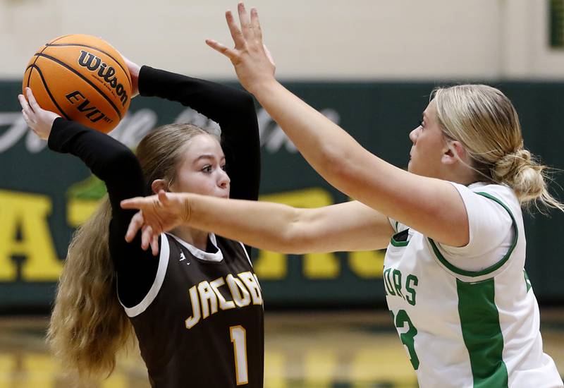 Jacobs' Sienna Ryan looks to pass the ball as she is defended byCrystal Lake South's Laken Lepage during a Fox Valley Conference basketball game on Friday, Jan. 17, 2025, at Crystal Lake South High School.