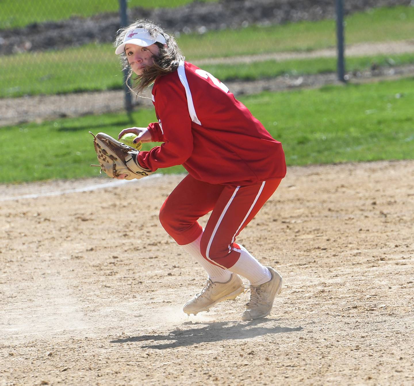 Oregon's Reilee Suter gets ready to throw to first during an April 16 game against North Boone at Oregon Park West.