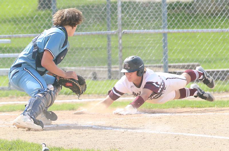 Rockridge's Keegan Bohnsack slides safe into home as Bureau Valley catcher bobbles the ball at the plate during the Class 2A Regional semifinal game on Thursday, May 16, 2024 at Princeton High School.