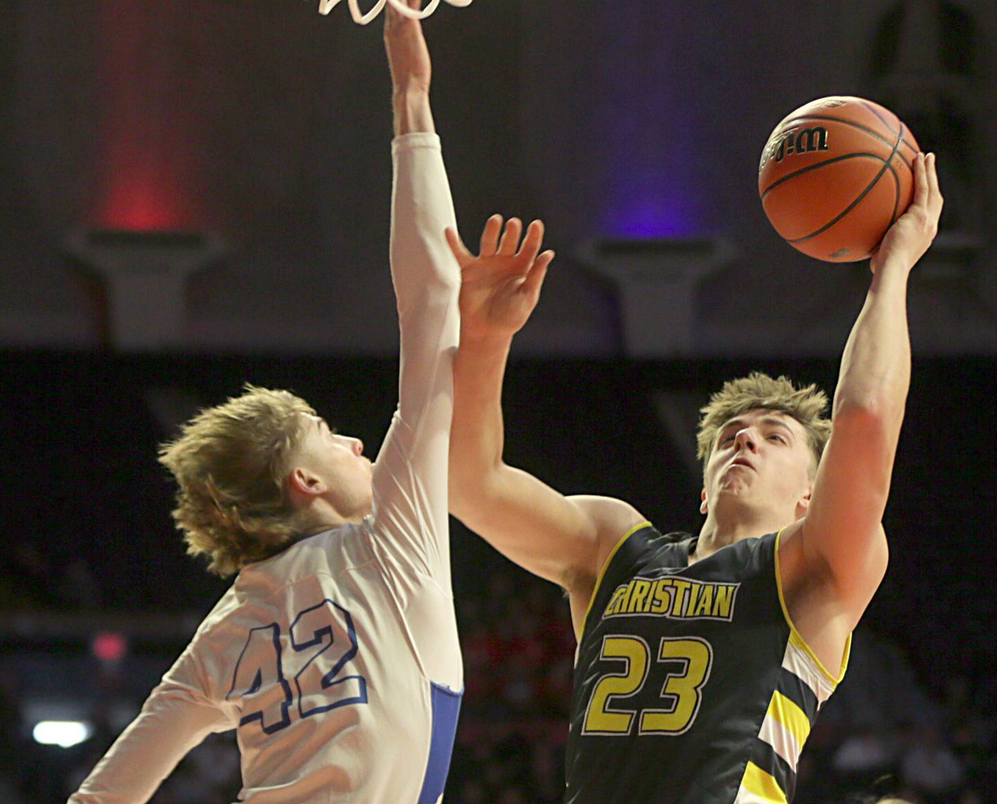 Yorkville Christian's Brayden Long (23) pulls up in the lane to shoot a shot over Steeleville's Reid Harriss (42) in the Class 1A State semifinal game on Thursday, March 10, 2022 at the State Farm Center in Champaign.