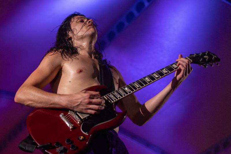 Kyle Lapato of Thunderstruck strums a guitar at the annual Cops for Cancer event on Friday, July 25, 2025, at Cerri Memorial Park in Cedar Point.