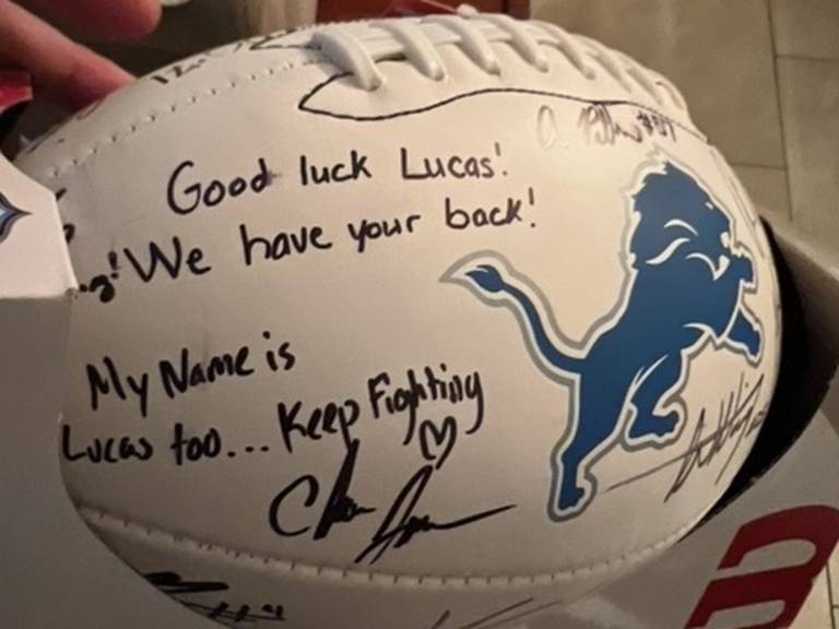 The football signed by Detroit Lions players that receiver Anthony Pittman sent to Huntley freshman Lucas Gidelski.