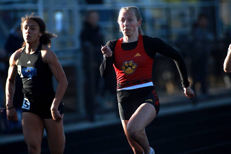 Batavia’s Elizabeth Wende (right) and St. Charles North's Alexzandria Richardson (left) compete in the 100-meter dash during the DuKane Conference Girls Outdoor Championship on Thursday, May 8, 2025 at Glenbard North in Carol Stream.