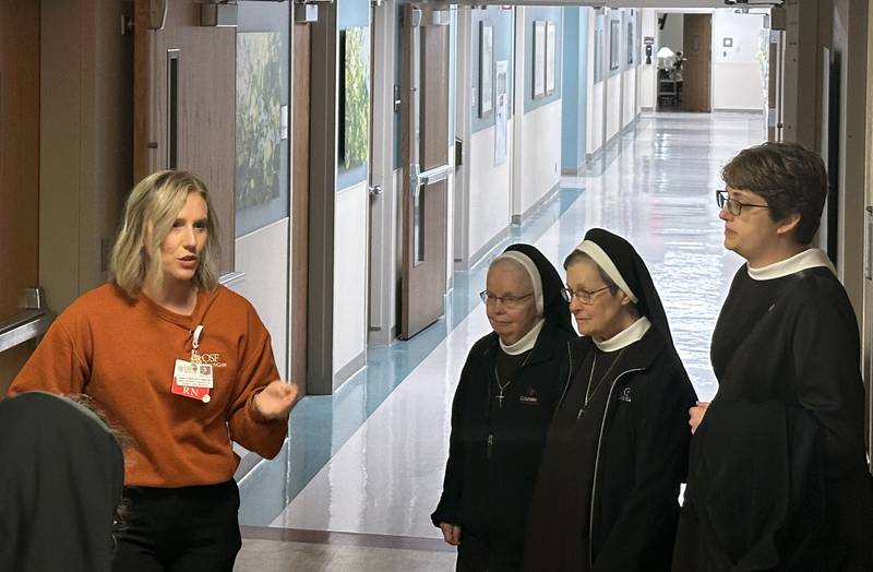 Hope Turigliatti Director of Medical Surgical Patient Care Services walks OSF Sisters on a tour inside the hospital on Thursday, Oct. 31, 2024 at OSF HealthCare Saint Elizabeth Medical Center in Peru.