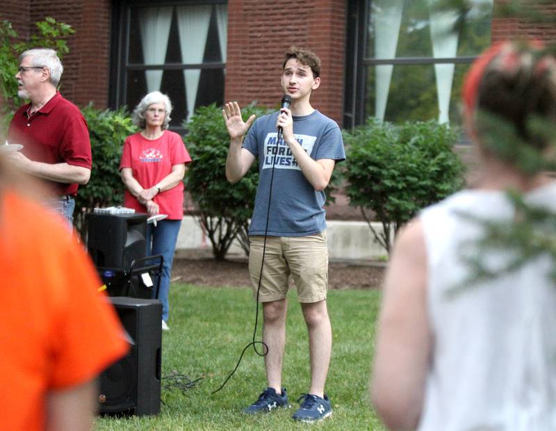 Arad Boxenbaum speaks during a candlelight vigil Wednesday, July 6, 2022, at the Kane County Courthouse in Geneva. The vigil was called to join in solidarity in honor of the mass shooting at a Fourth of July parade in Highland Park.