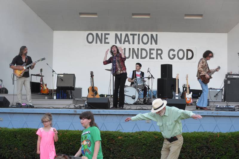 People dance to the music of Rocks Off as they perform a Rolling Stones tribute at the Mt. Morris Jamboree on Friday, June 20, 2025. The free evening concerts are held on Fridays through the summer on the Warren Reckmeyer Bandshell on the Campus in downtown Mt. Morris.