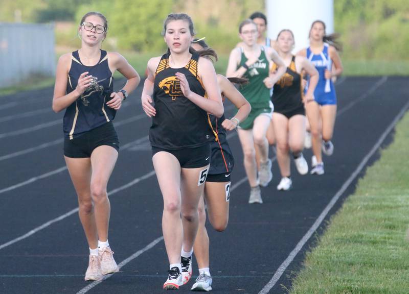 Marquette's Olivia Tamblyn and Putnam County's Haleigh Gren compete in the 800 meter run during the Class 1A Sectional meet on Wednesday, May 8, 2024 at Bureau Valley High School.