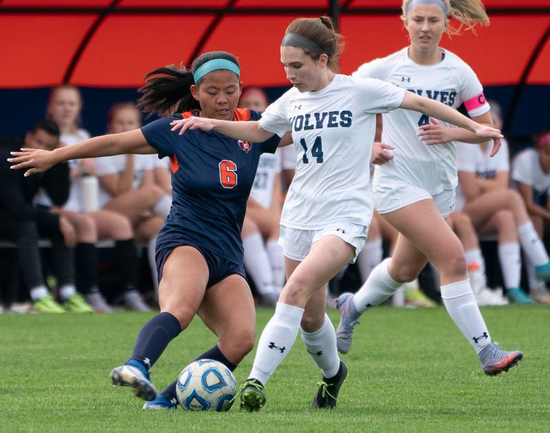 Oswego’s Selah Smith (6) challenges Oswego East's Taylor English (14) for the ball during a soccer match at Oswego High School on Monday, May 2, 2022.