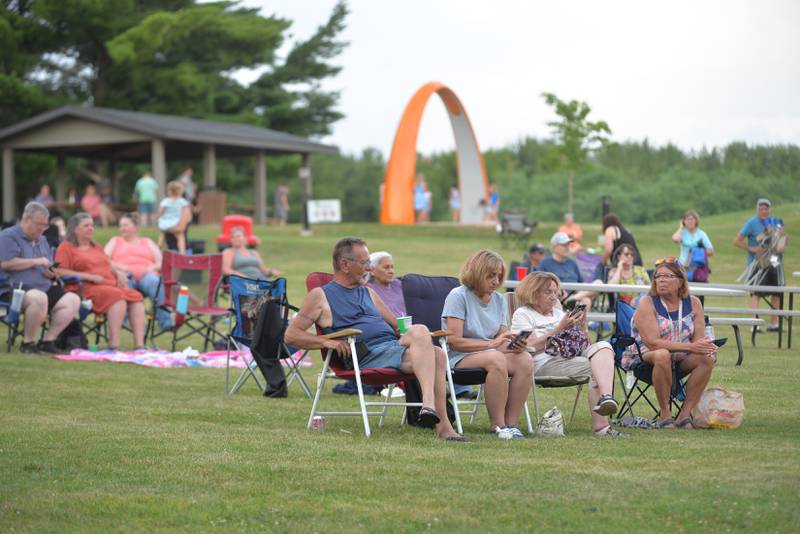 Families sit and listen to the music of “Buzzed by SonSET,” at the Oregon Park District’s Concert in the Park on Tuesday, June 24. The free concerts are held Tuesday nights at Oregon Park West.