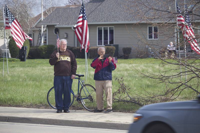 Attendees at the funeral procession on Friday, April 18, 2025, outside Tezak Funeral Home in Joliet, for for U.S. Army Staff Sgt. Jose Dueñez Jr. He was one of four soldiers who died March 31, 2025 when their armored vehicle sunk in a bog during a training mission in Lithuania.