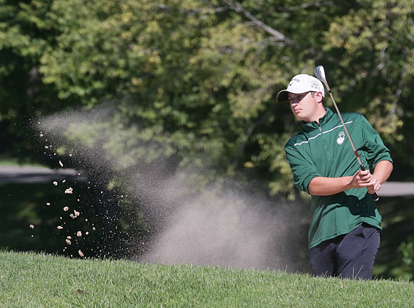 St. Bede's Jake Delaney gets out of the bunker during the Class 1A Regional on Wednesday, Sept. 28, 2022 at Spring Creek Golf Course in Spring Valley.