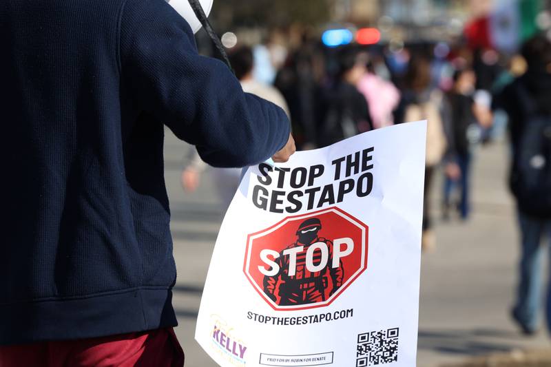A Kankakee High School student carries a sign as they participate in a walkout in protest of national immigration policies and Immigration and Customs Enforcement actions on Friday, Feb. 13, 2026.