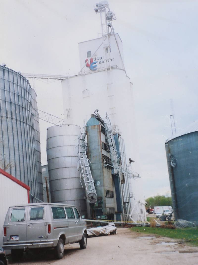 Stars form the Utica Elevator Company are twisted around grain bins from the tornado on Wednesday, April 21, 2004.