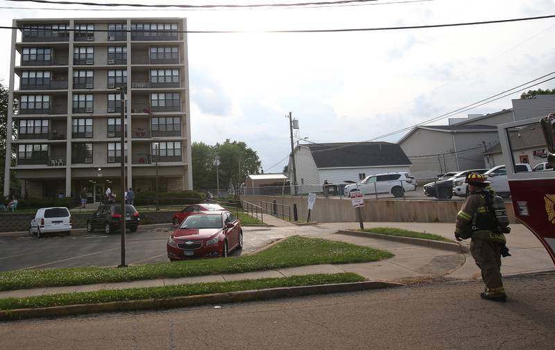 La Salle Firefighters (right) respond to a scene of a fire at the Housing Authority for La Salle County (Peru Hi-Rise) on Tuesday, June 17, 2025 in Peru. The fire happened shortly after 6p.m.