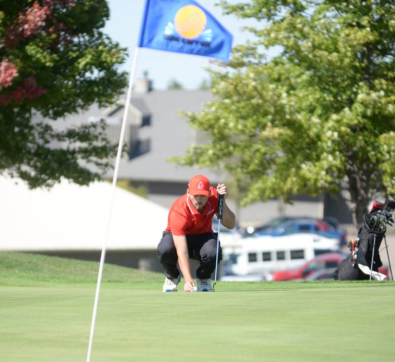 Amboy's Carson Barlow lines up a putt at the 1A Lanark Regional at Lake Carroll Golf Course on Wednesday, Oct. 2, 2024.