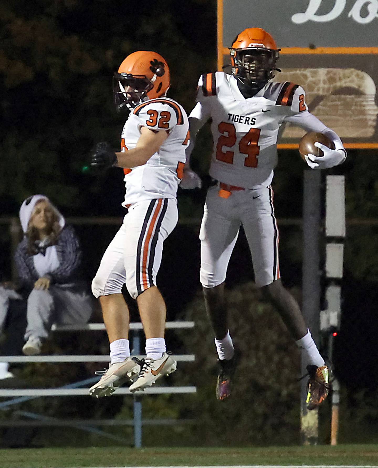 Wheaton Warrenville South's Amari Williams (24) and Max Schlegel (32) celebrate a late touchdown during the IHSA Class 7A playoffs Saturday October 28, 2023 in Arlington Heights.