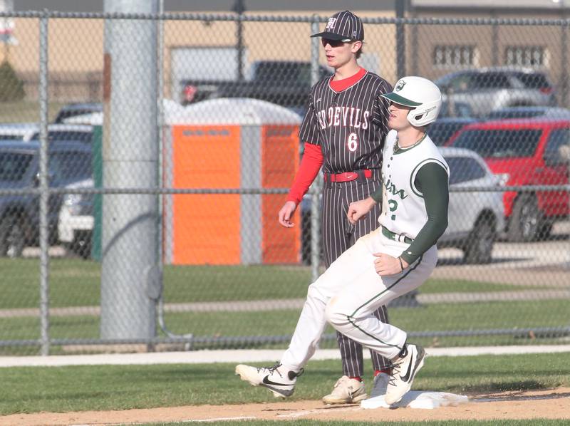 St. Bede's Gus Burr rounds third-base as Hall's Hunter Edgcomb watches the play on Monday, March 31, 2025 at Schweickert Stadium in Peru.