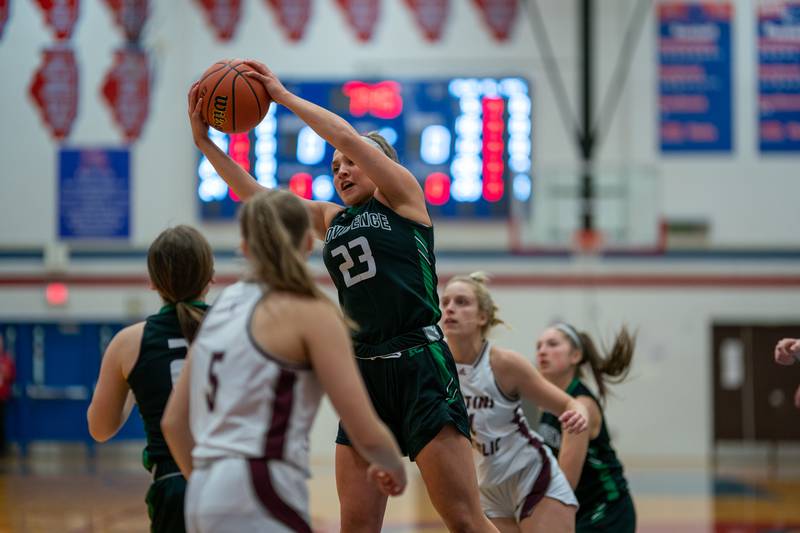 Providence's Annalise Pietrzyk (23) rebounds the ball against Montini during the 3A Glenbard South Sectional basketball final at Glenbard South High School in Glen Ellyn on Thursday, Feb 23, 2023.
