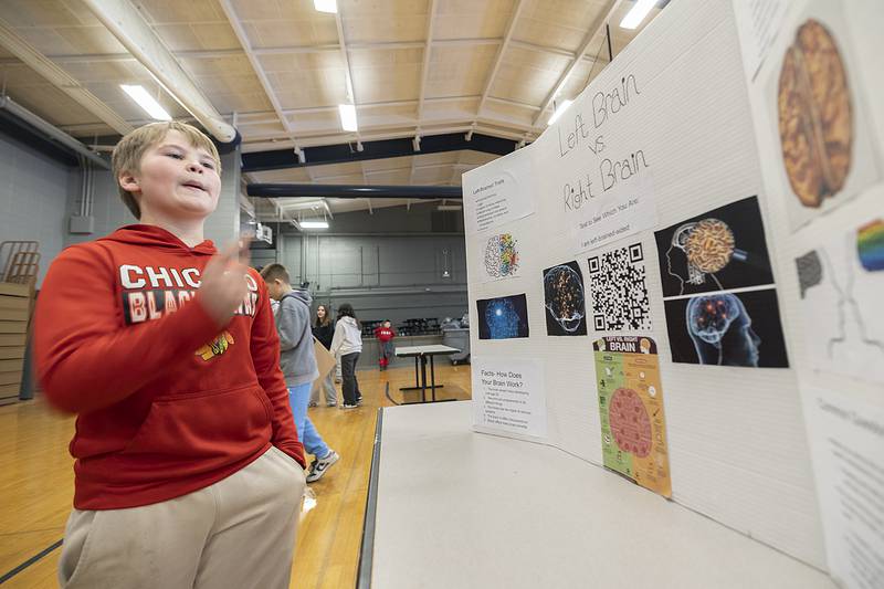 Brenan Mills, explains the difference traits between the left side and right side of the brain during his STEM presentation Thursday, March 6, 2025, at Challand Middle School.