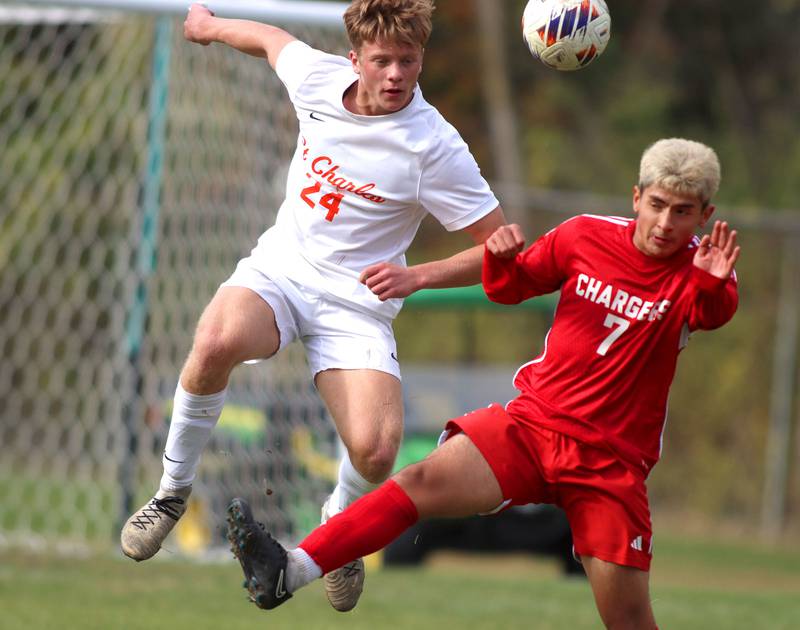 Dundee-Crown’s Hugo Arista, right, battles St. Charles East’s Colten Pariso in IHSA Class 3A Regional Championship soccer at Dundee-Crown High School in Carpentersville on Saturday, October 25, 2025.