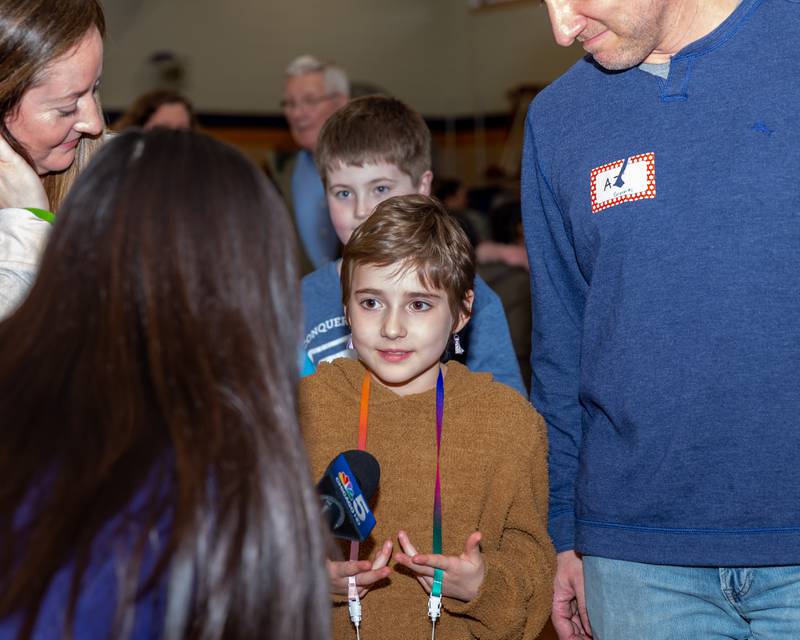 Gwen Cola is interviewed by local media at the St Baldricks Foundation event for at Forest Road Elementary School in La Grange Park. March 23, 2023.