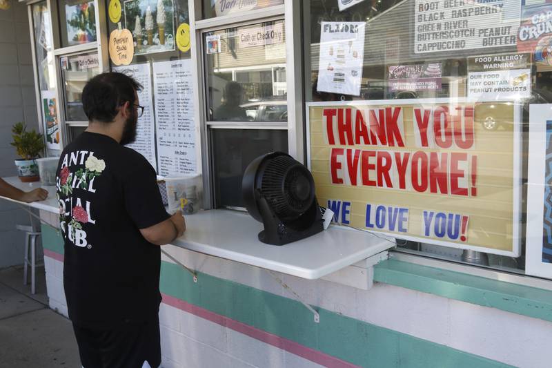 A “Thank You Everyone! We Love You!” Sign greats customers outside the Dari in Hebron Sunday, Sept. 18, 2022, to get food and ice cream. The Hebron landmark, that has been in operation for 53 years, is closing and up for sale. Sunday was their last day of operation.