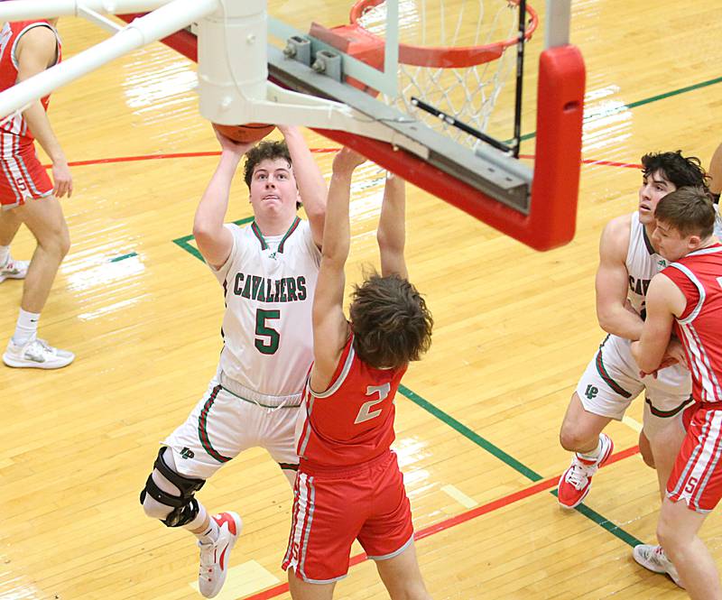 L-P's Tommy Hartman shoots a shot over Streator's Matt Williamson on Thursday, Jan. 26, 2023 at L-P High School.