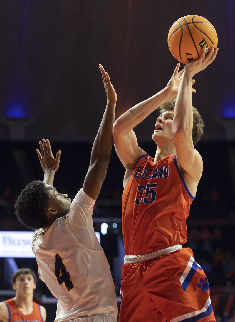 Eastland’s Parker Krogman puts up a shot over Peoria Christian’s Josh Walton Thursday, March 13, 2025, during the Class 1A boys basketball state semifinal.