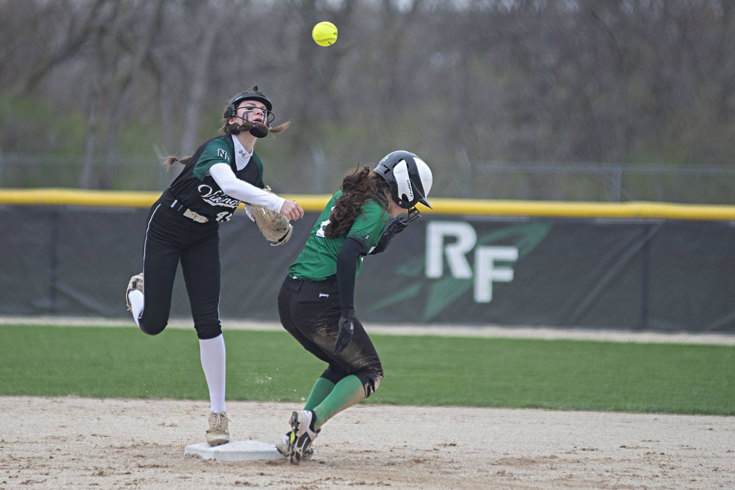 North Boone's Sydney Goodman tags second and throws to first Monday April, 25, 2022 against Rock Falls.