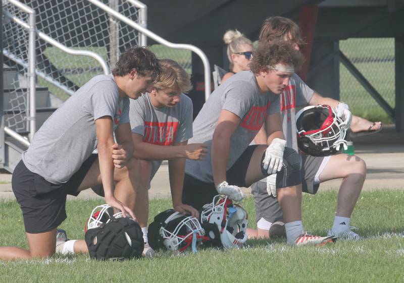 Ottawa football players take a knee while playing St. Bede during a 7-on-7 meet on Monday, July 17, 2023 at Ottawa High School.