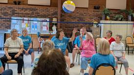 Serving up a good time – Seniors enjoy chair volleyball games at Yorkville’s Beecher Center