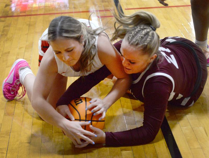 Marengo's Mia Feidt (21) and Stillman Valley's Amelia Dunseth (14) battle for the ball at the 2A Stillman Valley Regional on Monday, Feb. 17, 2025 at Stillman Valley High School.